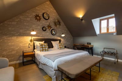 Lit King Size dans la chambre Coquette, idéale pour un weekend en amoureux